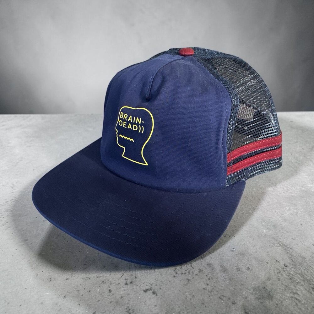 BRAIN DEAD Logohead trucker cap - Navy with yellow logo and red stripe detail